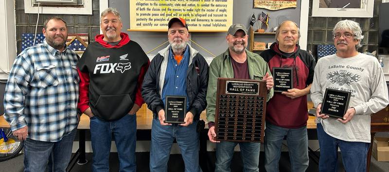 The La Salle County Motor Sports Hall of Fame held its induction ceremony on Wednesday, Nov. 20 at the Ottawa merican Legion Post 33, welcoming in three new members: Streator’s John Provenzano, Marseilles’ Dave Price and Ottawa’s Pat Dresen. The plaque bearing the names of all the inductees is on display at the Napa Auto Parts store in Ottawa. Pictured at the event are (from left) committeemen Casey Rock and Tom Kinkin, Price, event founder and organizer Hank Walsh, Provanzano and Dresen.