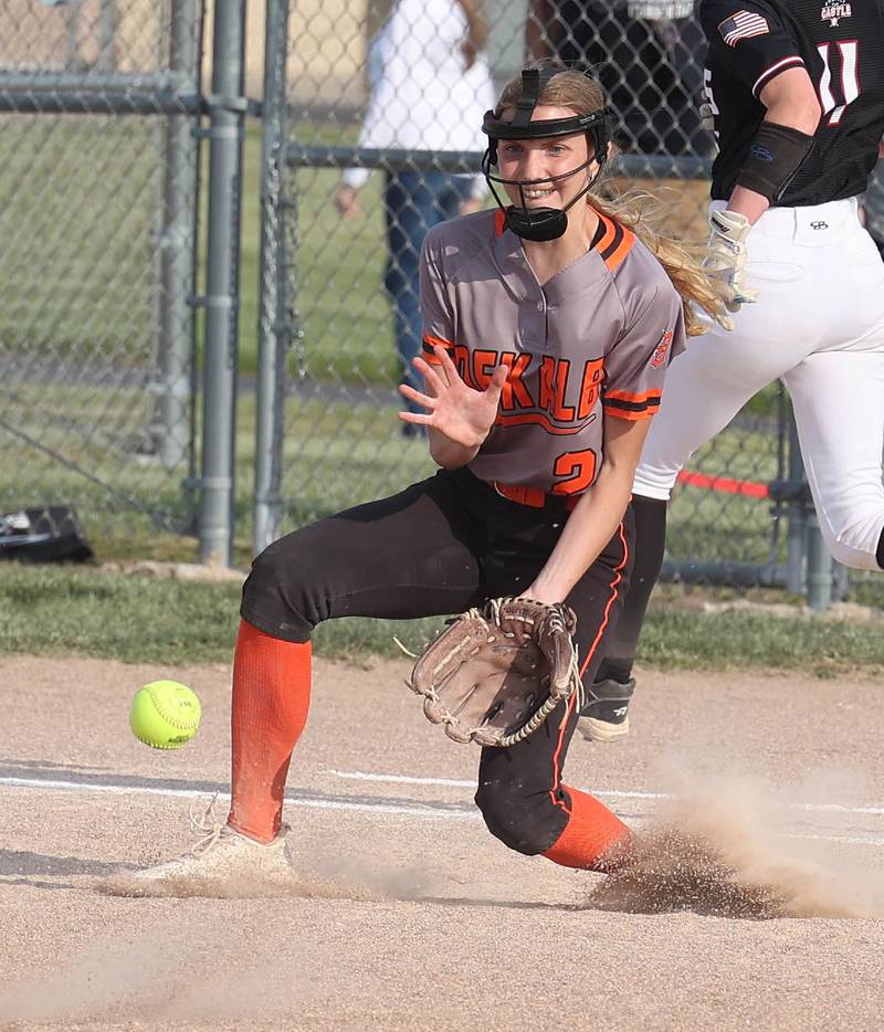 Dekalb's Megan Gates gets down to catch an errant throw during their Class 4A regional game against Auburn Wednesday, May 24, 2023, at DeKalb High School.