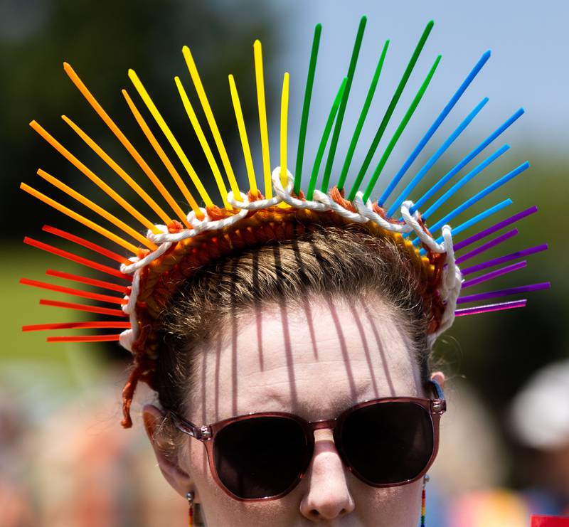 Rachel Duff wears a crown made to look like an “Upset Statue of Liberty” during a “No Kings Day” Protest against President Donald Trump’s policies along South Randall Road in Geneva on Saturday, June 14, 2025.