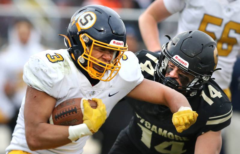 Sterling's Antonio Tablante tries to fend off Sycamore's Kiefer Tarnoki during their Class 5A state playoff game Saturday, Nov. 12, 2022, at Sycamore High School.