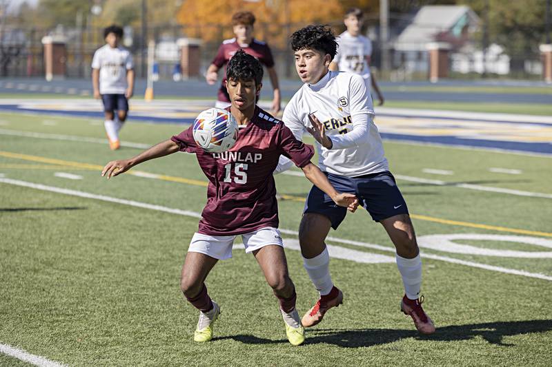 Sterling’s Jose Castro and Dunlap’s Yoshant Adhikari battle for the ball Saturday, Oct. 21, 2023 in the regional finals game in Sterling.