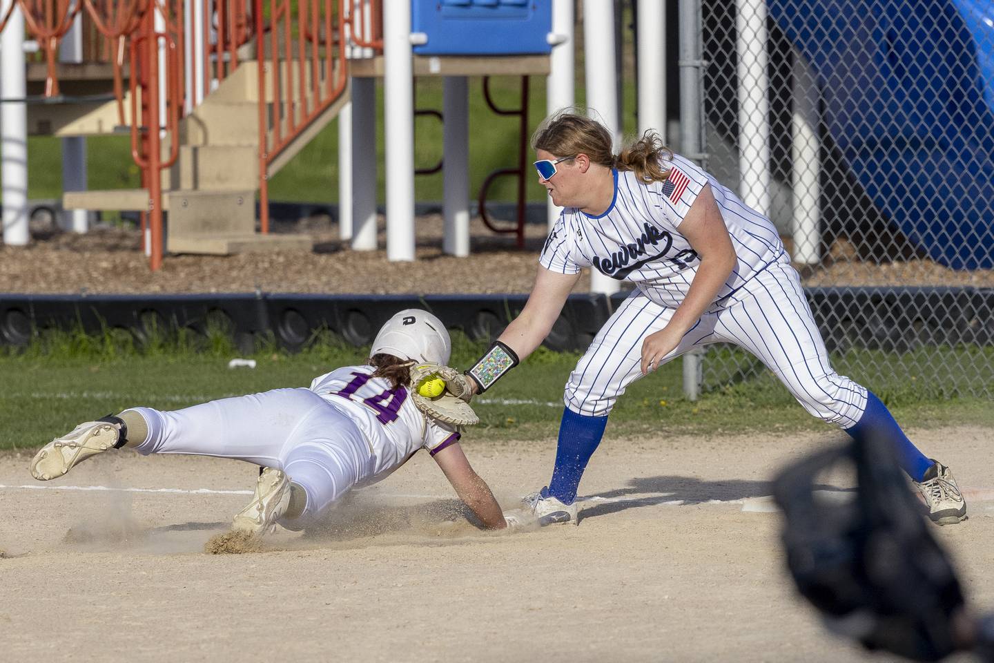 Serena's Lanee Cole is caught off the bag and tagged out by Kate Bromeland at first base during the game on April 29, 2025 at Newark High School.