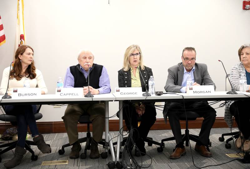 Susan George (center), candidate for Campton Hills trustee, answers a question as (from left) candidates Janet Burson, Charles Cappell, Timothy Morgan and Wendy White Eagle look on during a candidates’ forum hosted by the League of Women Voters at the Campton Hills Village Hall on Thursday, March 2, 2023.