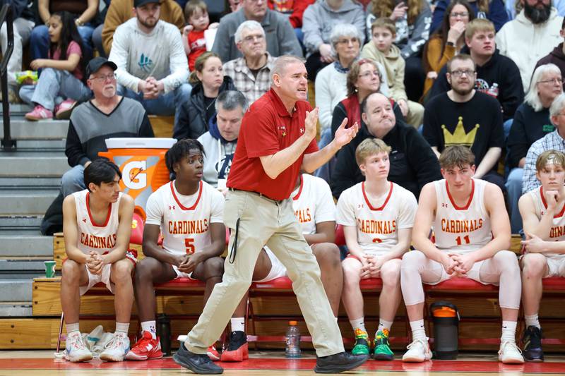 St. Anne head coach Rick Schoon communicates to his players from the sideline during St. Anne's 64-43 victory over Momence in the River Valley Conference semifinals on Tuesday, Feb. 10, 2026. The win tallied Schoon's 500th career coaching victory.