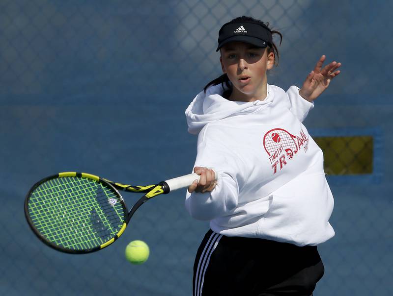 Timothy Christian’s Jane Carter returns the ball Thursday, Oct. 20, 2022, during during the first day of the IHSA State Girls Tennis Tournament at Hoffman Estates High School in Hoffman Estates.