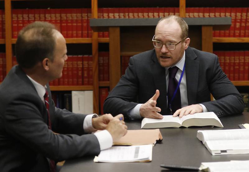 McHenry County State's Attorney Patrick Kenneally (right) talks with Criminal Division Chief James Newman Wednesday, Dec. 28, 2022, about changes implemented as a result of the SAFE-T Act at their office in the McHenry County Government Center in Woodstock.