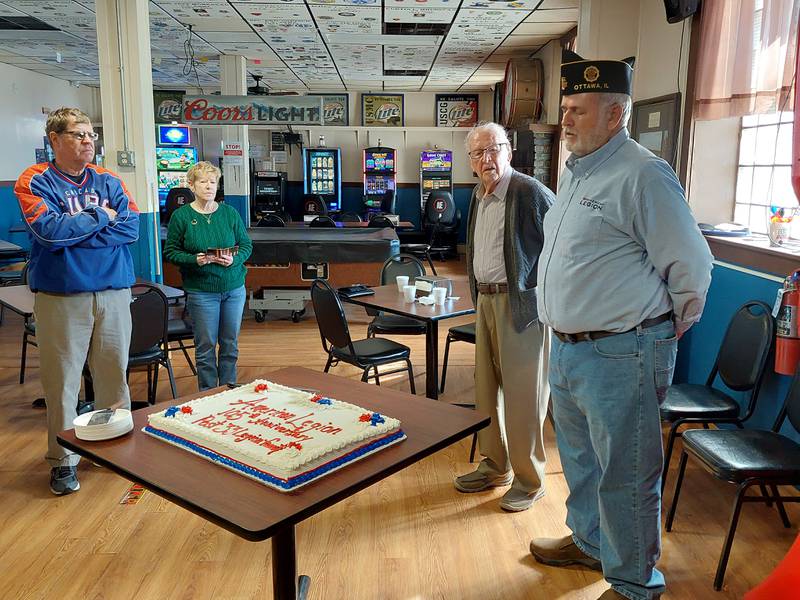 World War II veteran Francis "Kay" Killelea (second from left) listens to Ottawa American Legion Commander Tom Shea speak about the history of the national organization during the American Legion's 105th anniversary open house Saturday, March 16, 2024, at the Ottawa post.