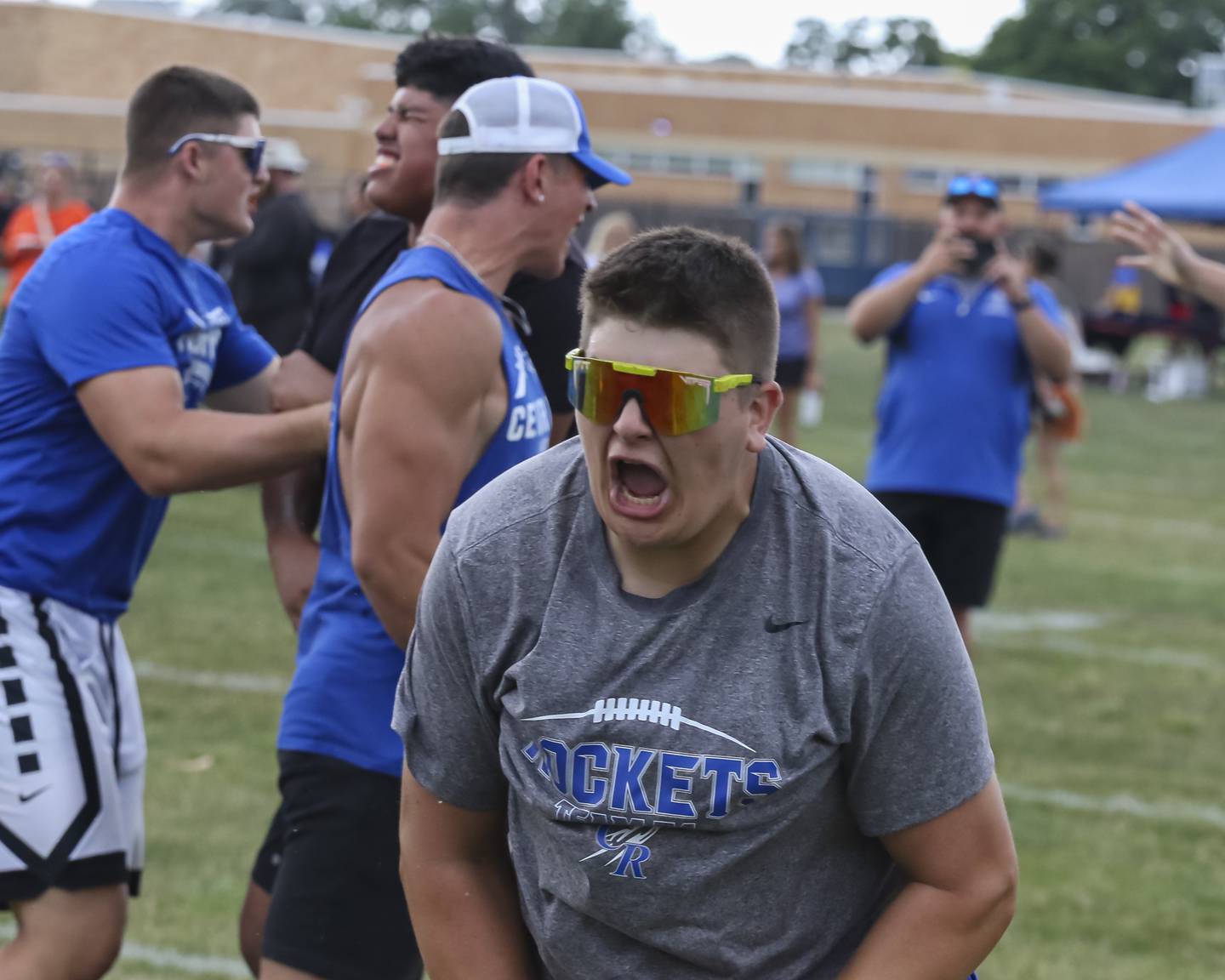 Burllngton Central's Henry Crumlett celebrates with his teammates after winning the Tug of War Tournament during the West Aurora "Battle of the Butts" Lineman Challenge, July 10, 2025  in Aurora.