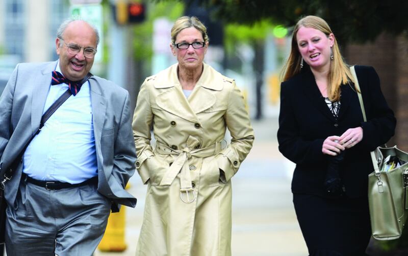 Flanked by her attorneys, federal public defenders Paul Gaziano and Kristin Carpenter, former Dixon Comptroller Rita Crundwell arrives at U.S. District Court in Rockford Monday morning, where she pleaded not guilty to wire fraud.