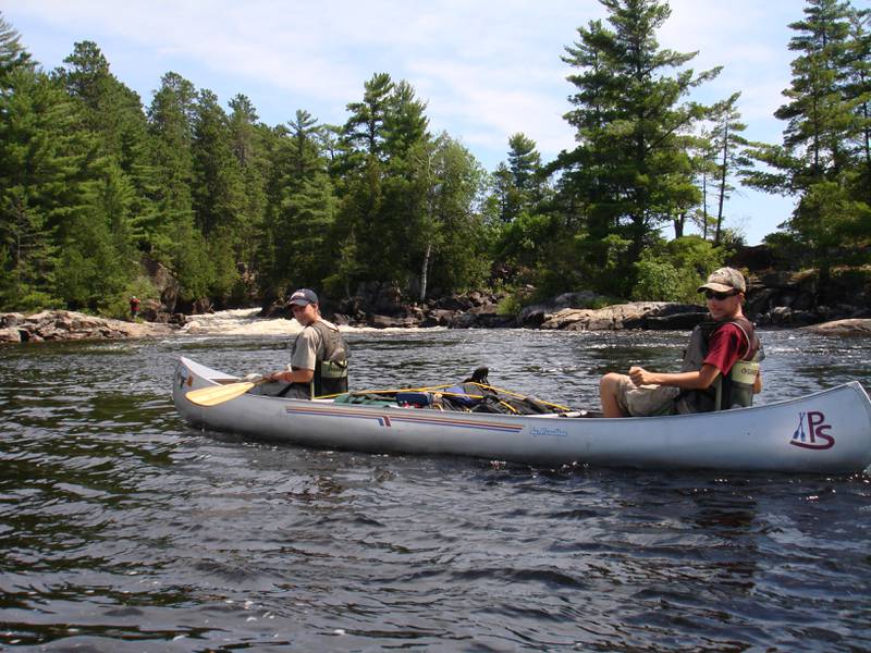 Boy scouts from Waltham troop #797 row a canoe as part of troop activities