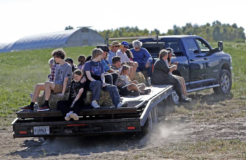 People head out for a hayride farm tour during a stop on the McHenry County Farm Stroll on Sunday, Sept. 29, 2024, at Wanda Fram in Harvard. The farm stroll, a self-guided tour of McHenry County’s family farms, featured farm tours, demonstrations and products for sale at eleven farms.