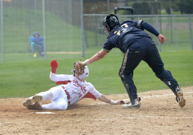 Polo catcher Jeffrey Donaldson tags Oregon's Jack Washburn at home during a Saturday, April 27, 2024 game in Oregon. The Marcos fell to the Hawks 7-1.