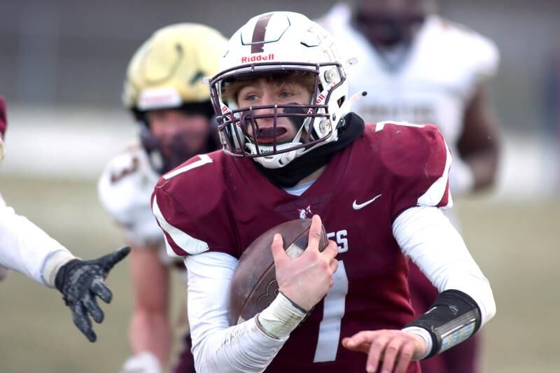 Prairie Ridge’s Tyler Vasey looks for running room against St. Ignatius in Class 6A football playoff semifinal action at Crystal Lake on Saturday.