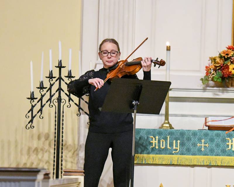 Violinist Courtney Hanna-McNamara performs "Let There Be Peace On Earth" during a prayer vigil for the peace in Israel and Palestine held on Tuesday, Nov. 21, 2023, at the First Congregation United Church of Christ in DeKalb.