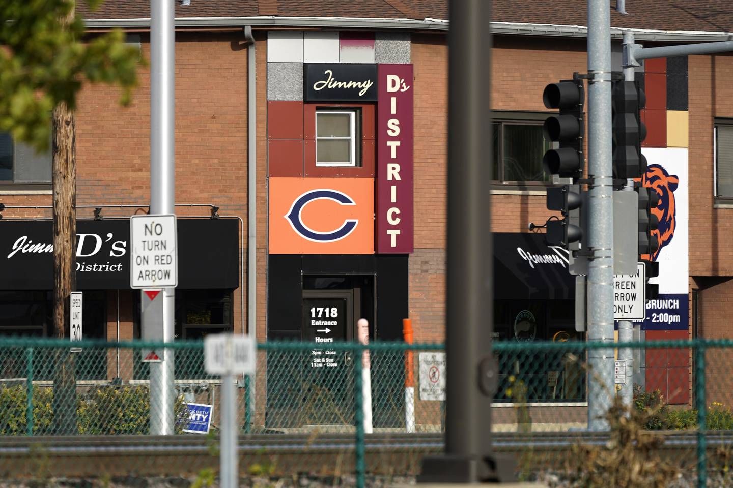 A Chicago Bears logo is seen at a restaurant near Arlington International Racecourse in Arlington Heights, Ill., Friday, Oct. 14, 2022. With the horses long gone, the Chicago Bears see 326 acres of opportunity at the site. The Buffalo Bills also are making plans for a new home. Same for the Tennessee Titans and baseball's Kansas City Royals. Major League Soccer's Inter Miami is working on its new place, and on and on it goes. (AP Photo/Nam Y. Huh)