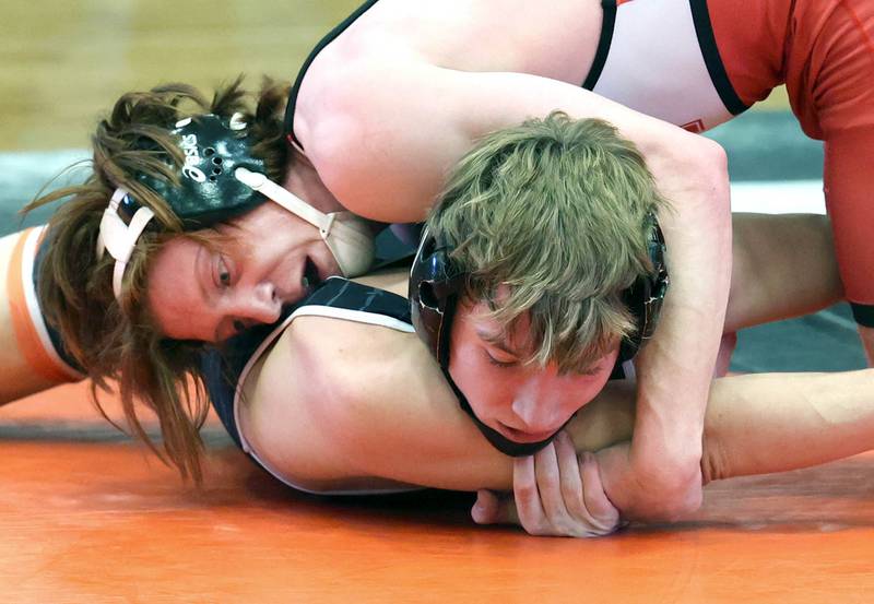 Naperville Central’s Gavin Bohan and DeKalb’s Sean Kolkebeck wrestle in close 160 pound semifinal match Friday, Jan. 20, 2023, during the DuPage Valley Conference wrestling tournament at DeKalb High School.
