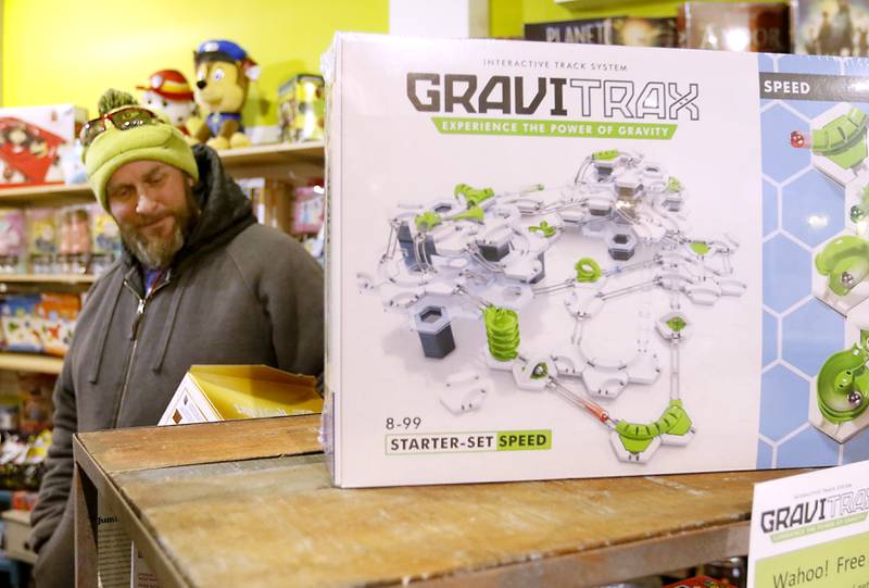 Joe Smith, of Woodstock, shops for Christmas presents Monday, Dec. 19, 2022, at Marvin's Toy Store in Crystal Lake. This year, Marvin's most popular items are  construction kits and screen-less-technology toys, including the Toniebox, that reads stories to children.