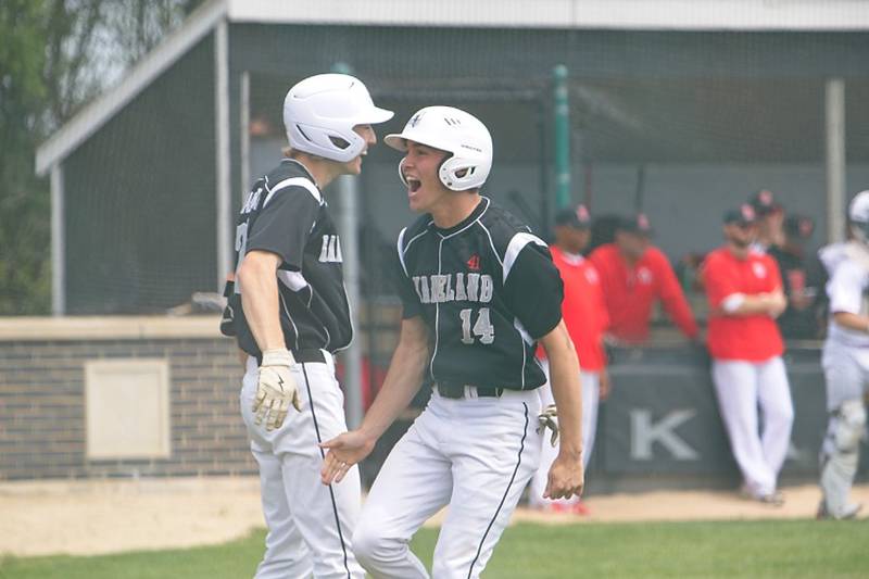 Kaneland's Preston Popovich(14) celebrates a run scored with Nathan Campbell (7) against Benet at the Class 3A Kaneland Regional Final on Saturday, May 31, 2025 in Maple Park.