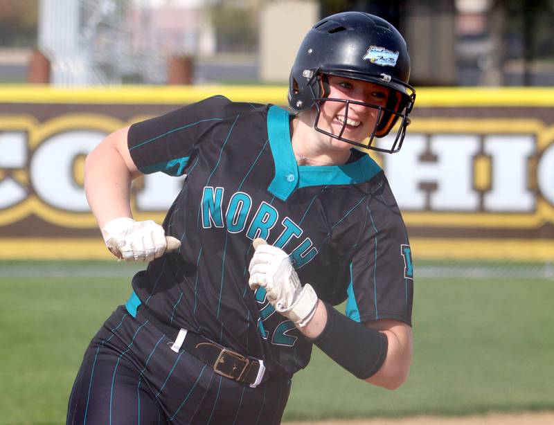Woodstock North’s Casey Vermett rounds third base on her first of two home runs against Jacobs in varsity softball at Algonquin Friday night.