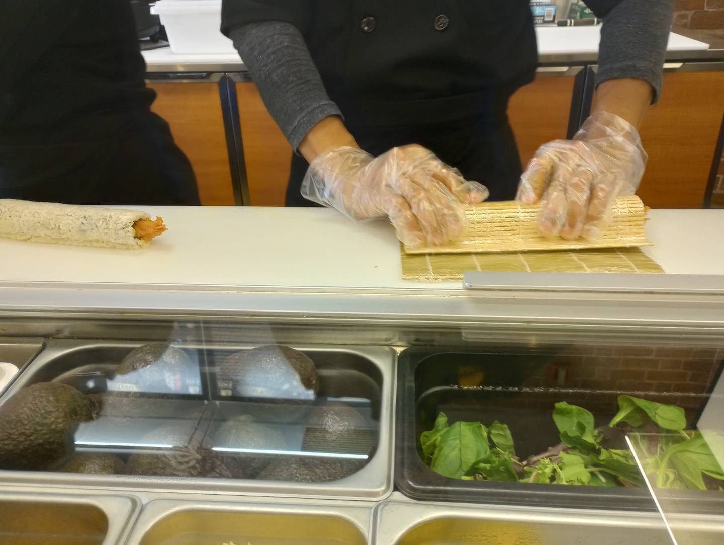 Khine Zaw rolls sushi for a large dinner order at the new restaurant, Zen’s Sushi Express, 1459 E. State St., Geneva, which he owns with his wife, Cho Wai.