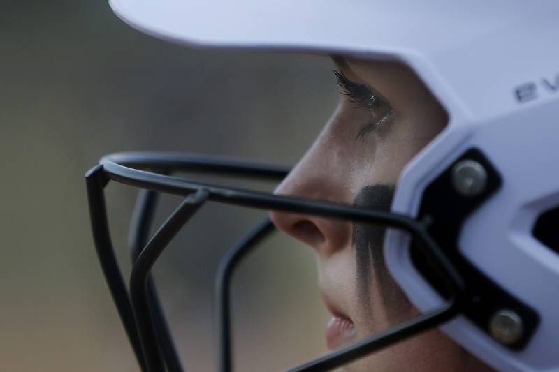 Richmond-Burton’s Hailey Holtz watches her teammate bat from the on deck circle during a nonconference softball game against Cary-Grove Tuesday, March 21, 2023, at Cary-Grove High School.