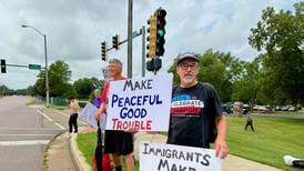 Despite rain, some still show up to make ‘Good Trouble’ at DeKalb protest