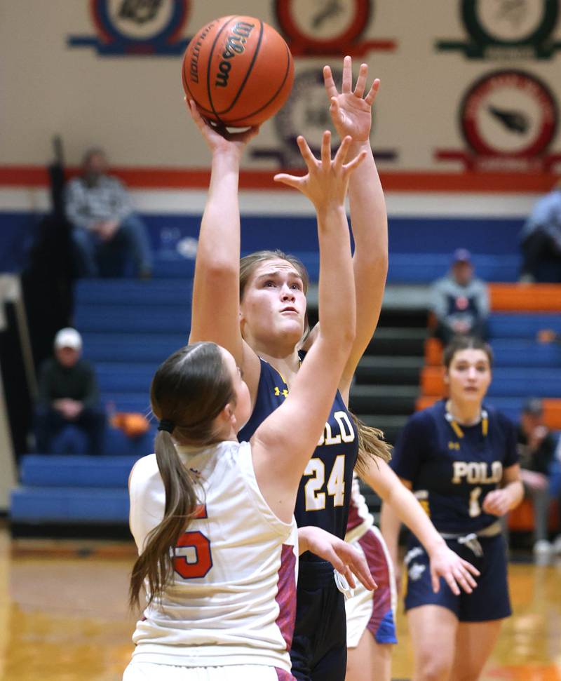 Polo’s Katelyn Rockwood shoots over Genoa-Kingston's Zoe Boylen during their game Monday, Jan. 29, 2024, at Genoa-Kingston High School.