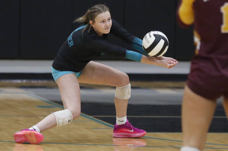 Woodstock North's Tayler Menzel bumps a serve forward during a Kishwaukee River Conference volleyball match against Richmond-Burton on Monday, Sept. 15, 2025, at the Woodstock North High School.
