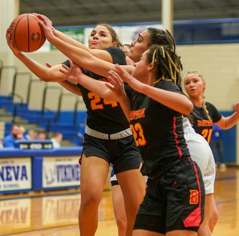 Batavia’s Hallie Crane (24) rebounds the ball against Geneva during a basketball game at Geneva High School on Friday, Dec 15, 2023.