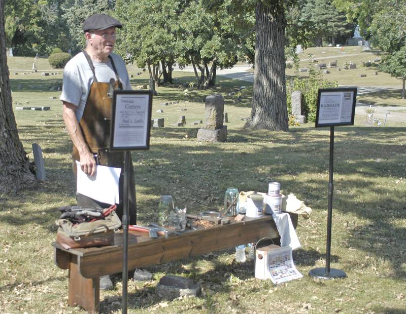 Mike McBride as Paul Lord, an early wagon and carriage builder, shows some early hardware. The Lee County Historical and Genealogical Society sponsored a cemetery walk at Oakwood Cemetery in  Dixon on Sunday, Sept. 28.