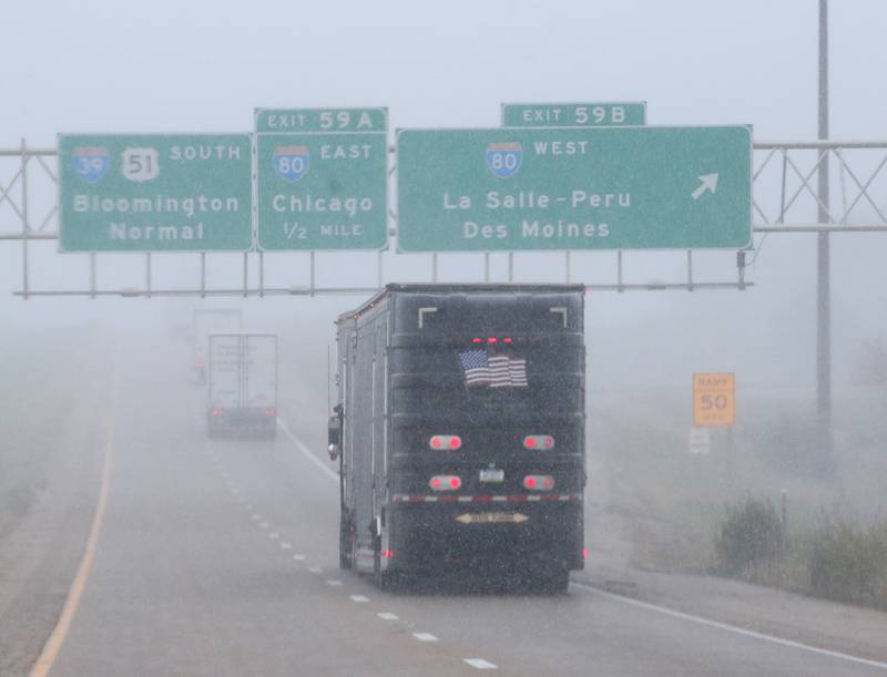 A mix precipitation of rain, sleet and snow falls at the Interstate 80 and Interstate 39 intersection on Tuesday, Oct. 31, 2023 near La Salle.