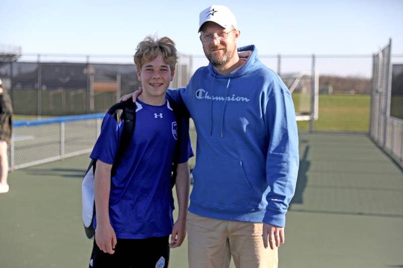 Geneva freshman Tyler Masoncup poses with his dad, St. Charles North Head Coach Sean Masoncup, after a match between the two teams on Thursday, April 21, 2022.