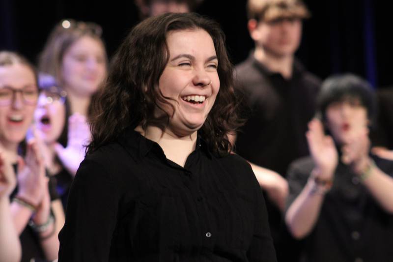 Madison School's Sarah Purlee is all smiles after being urged to join the Choir Fest performance as a percussionist on Friday, March 3, 2023.