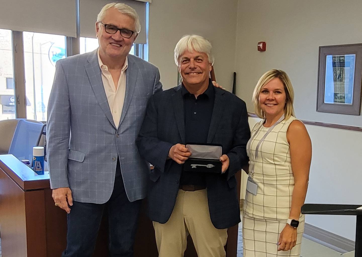 Retiring St. Charles Alderperson Todd Bancoft was honored with the key to the city at his final City Council meeting at City Hall on June 19, 2023.  (from left to right: former mayor Ray Rogina, Bancroft and Mayor Lora Vitek)