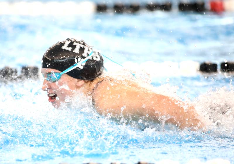 Lyons Township’s Maeve Collins competes in the 100-yard butterfly championship heat during the IHSA Girls State Championships on Saturday, Nov. 16, 2024 at FMC Natatorium in Westmont.