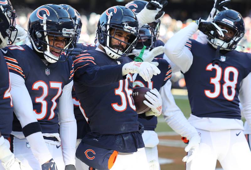 Chicago Bears safety DeAndre Houston-Carson celebrates with his defense after intercepting a pass during their game against the Eagles Sunday, Dec. 18, 2022, at Soldier Field in Chicago.