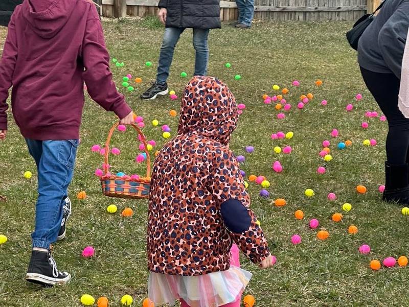 A young participant prepares to choose from the colorful array of eggs during the 2024 Bremer Team Easter Egg Hunt at the McHenry Outdoor Theater. This year's hunt takes place Saturday, April 12, and for the first time will include an adult component with prizes.