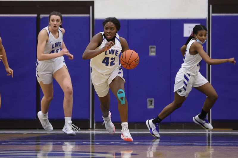 Lincoln-Way East’s Sanai Tyler takes the ball up court against Lockport in the Class 4A Lincoln-Way East Regional semifinal. Monday, Feb. 14, 2022, in Frankfort.