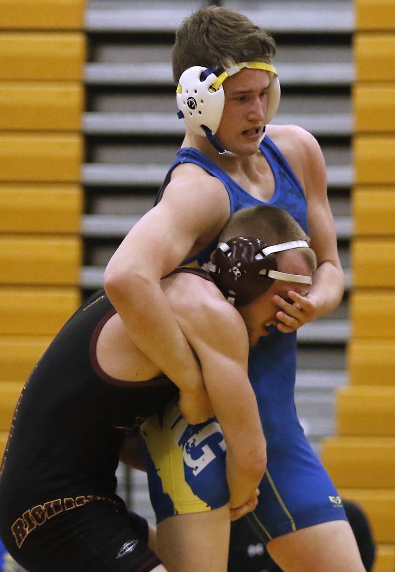 Richmond-Burton's Issac Jones picks up Johnsburg's Carson Teschner during the 157-pound match of a Kishwaukee River Conference wrestling match on Thursday, Jan. 25, 2024, at Richmond-Burton High School.
