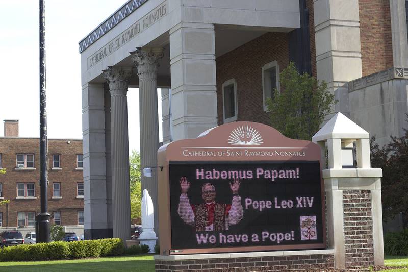 A digital sign with a photo of newly-elected Pope Leo XIV on Friday, May 9, 2025, outside Cathedral of St. Raymond Nonnatus in Joliet. A Mass was held the same morning celebrating the new pope.