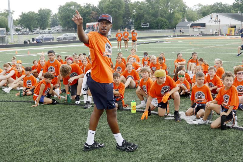 Lenny Smith explains drill stations during the Chicago Bears Mini Monsters Flag Football Camp on Wednesday, July 16, 2025. at McCracken Field in McHenry.