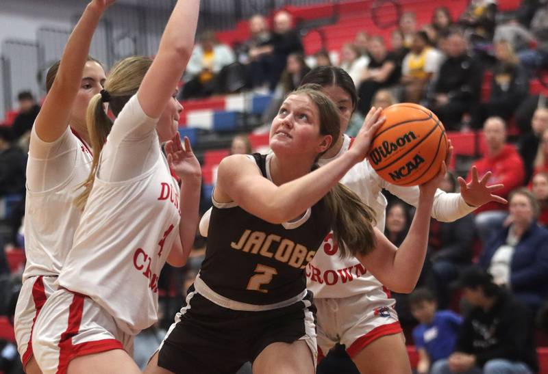 Jacobs’ Sarina Acheatel works under the hoop in varsity girls basketball on Friday, Dec. 12, 2025, at Dundee-Crown High School in Carpentersville.