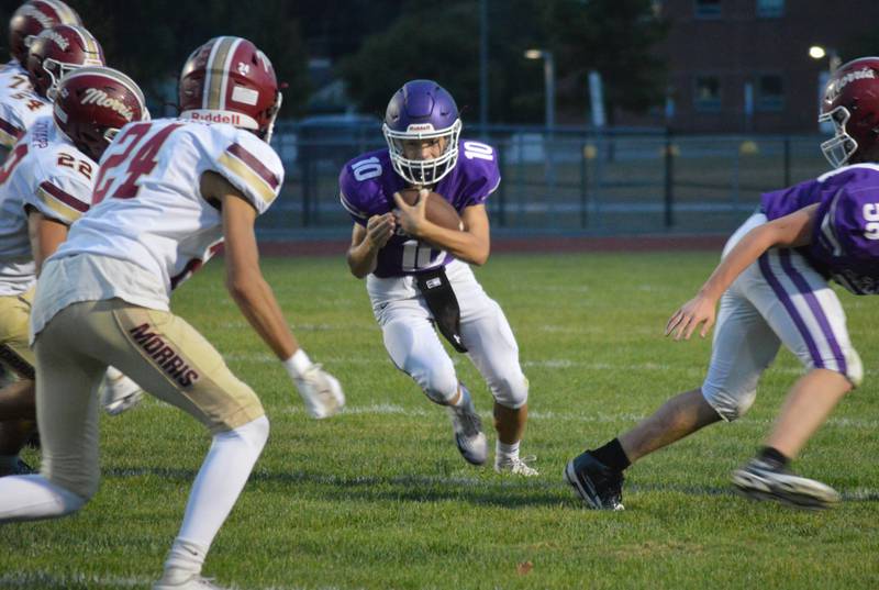Rochelle quarterback Riley Smith sneaks for a first down during a game with Morris. Rochelle won the game 12-8.