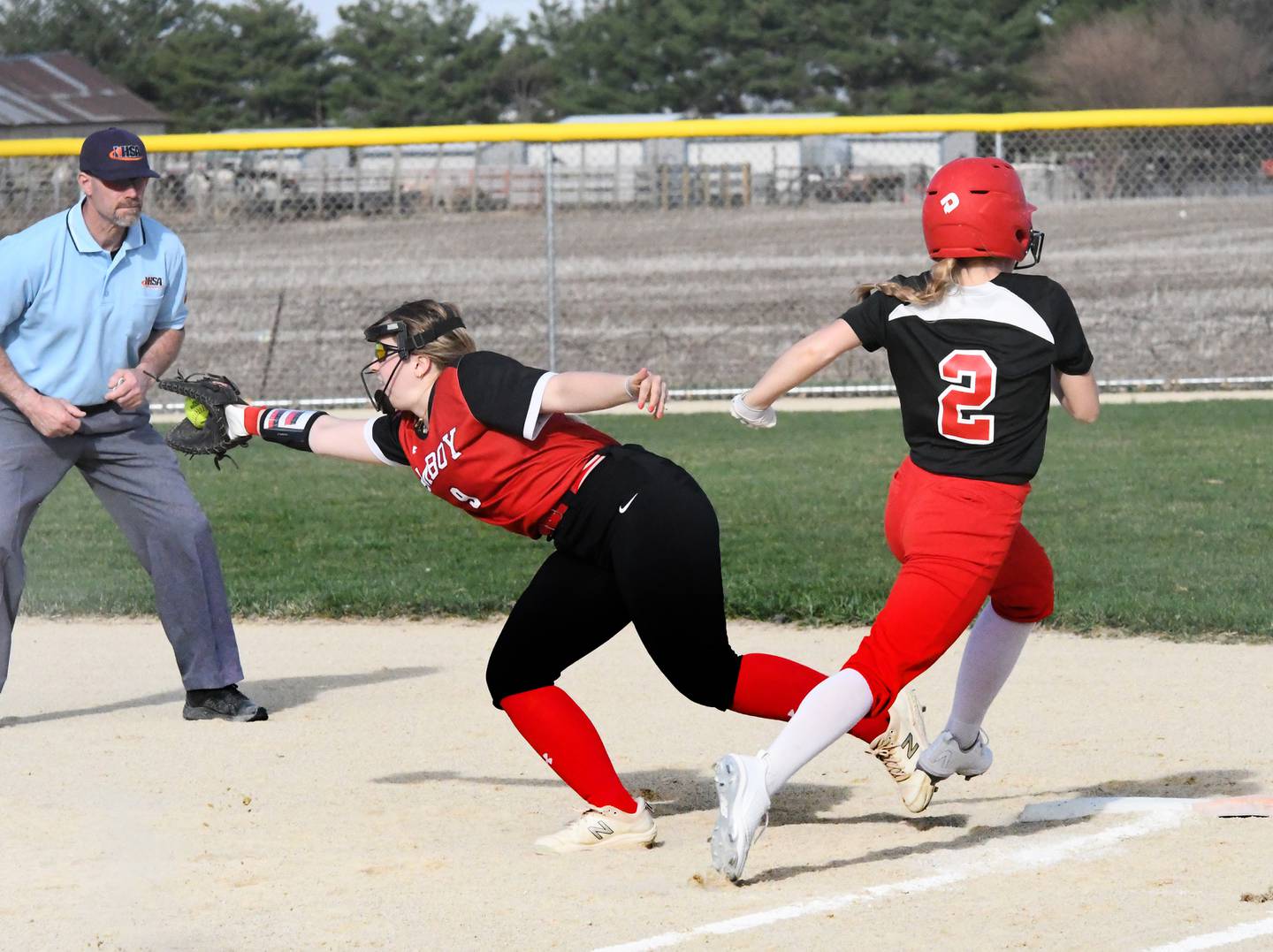 Forreston's Alaina Miller beats out a throw to first as Amboy first baseman Haleigh Stenzel stretches for the throw during Thursday, April 13 action in Forreston.