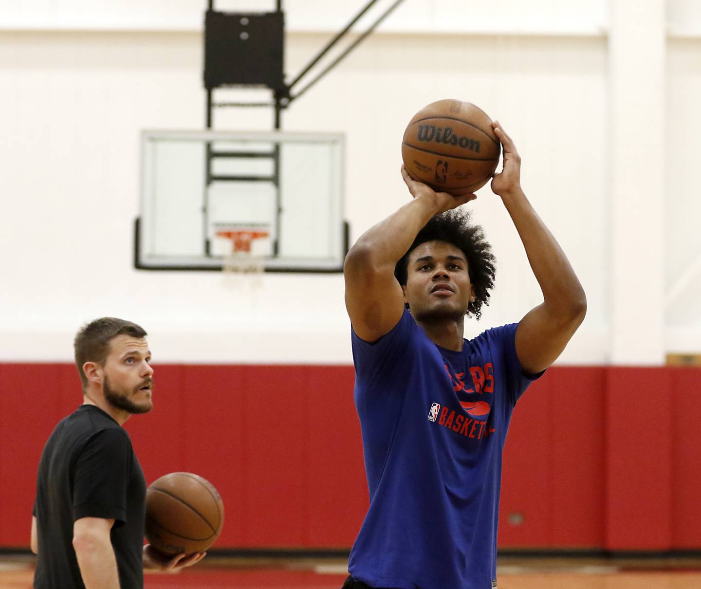 Zac Boster, the assistant men's basketball coach at Triton College in River Grove, and a Huntley graduate, watches Justin Smith’s shot as he works with him on his basketball skills Thursday morning, Sept. 29, 2022. Boster has made a name for himself in the basketball world, teaching skills to high-level college and pro players.