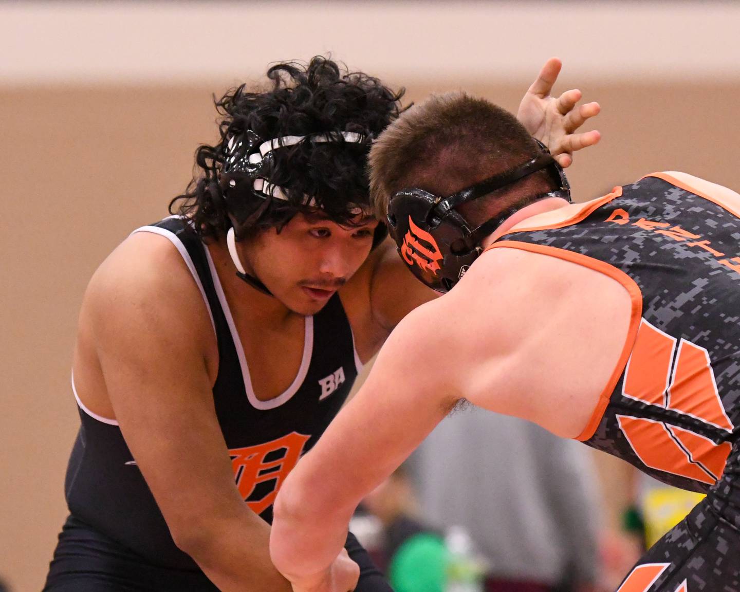DeKalb’s wrestling Elvis Mora, left, keeps his focus on Washington’s Wyatt Leman in the 190-weight class on Friday Dec. 27, 2024, during the Don Flavin invite held in DeKalb.