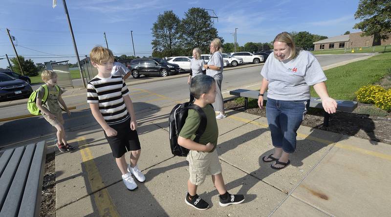 Teachers and staff welcome back students Wednesday, Aug. 16, 2023, as they make their way into Centennial School in Streator for the first day of classes.