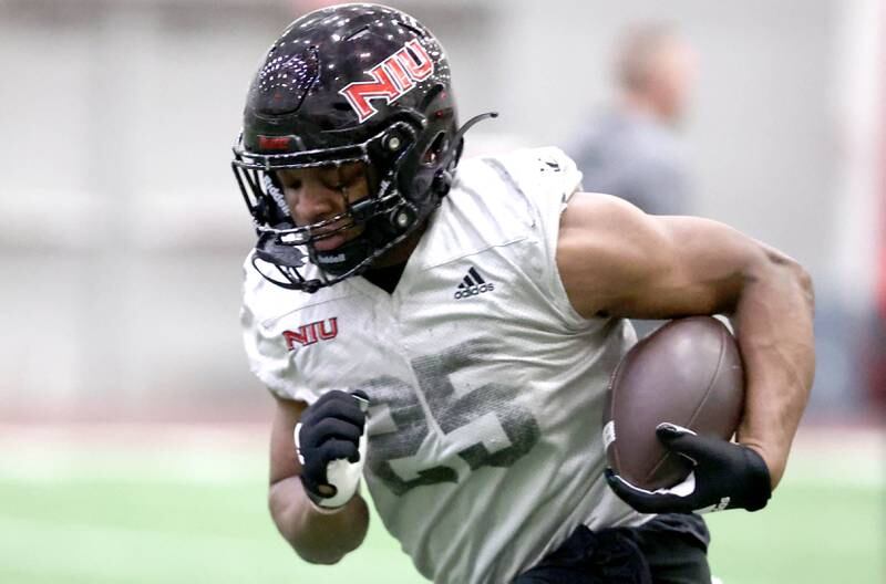 Northern Illinois running back Christian Nash carries the ball during their first spring practice Wednesday, March 22, 2023, in the Chessick Practice Center at Northern Illinois University in DeKalb.