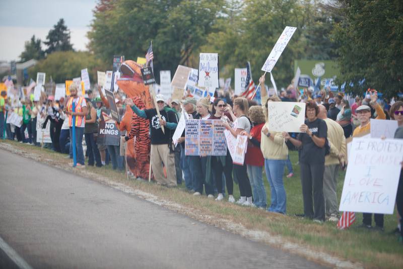 Locals gather at the NO Kings rally along Randall Rd. on Saturday, Oct.18,2025 in Geneva.