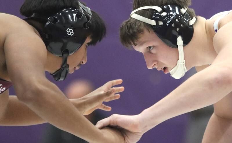 Hampshire’s Gio Marino ,right, battles Prairie Ridge’s Aiden Rodriguez at 175 pounds in varsity wrestling on Thursday, Dec. 5, 2024 at Hampshire High School in Hampshire.